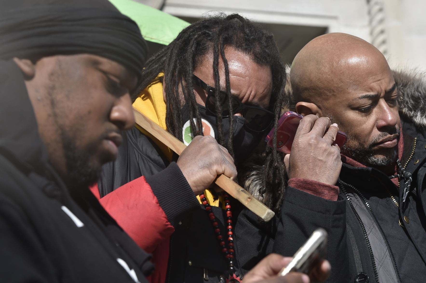 Justin Blake and Bishop Tavis Grant listen to Kyle Rittenhouse verdicts